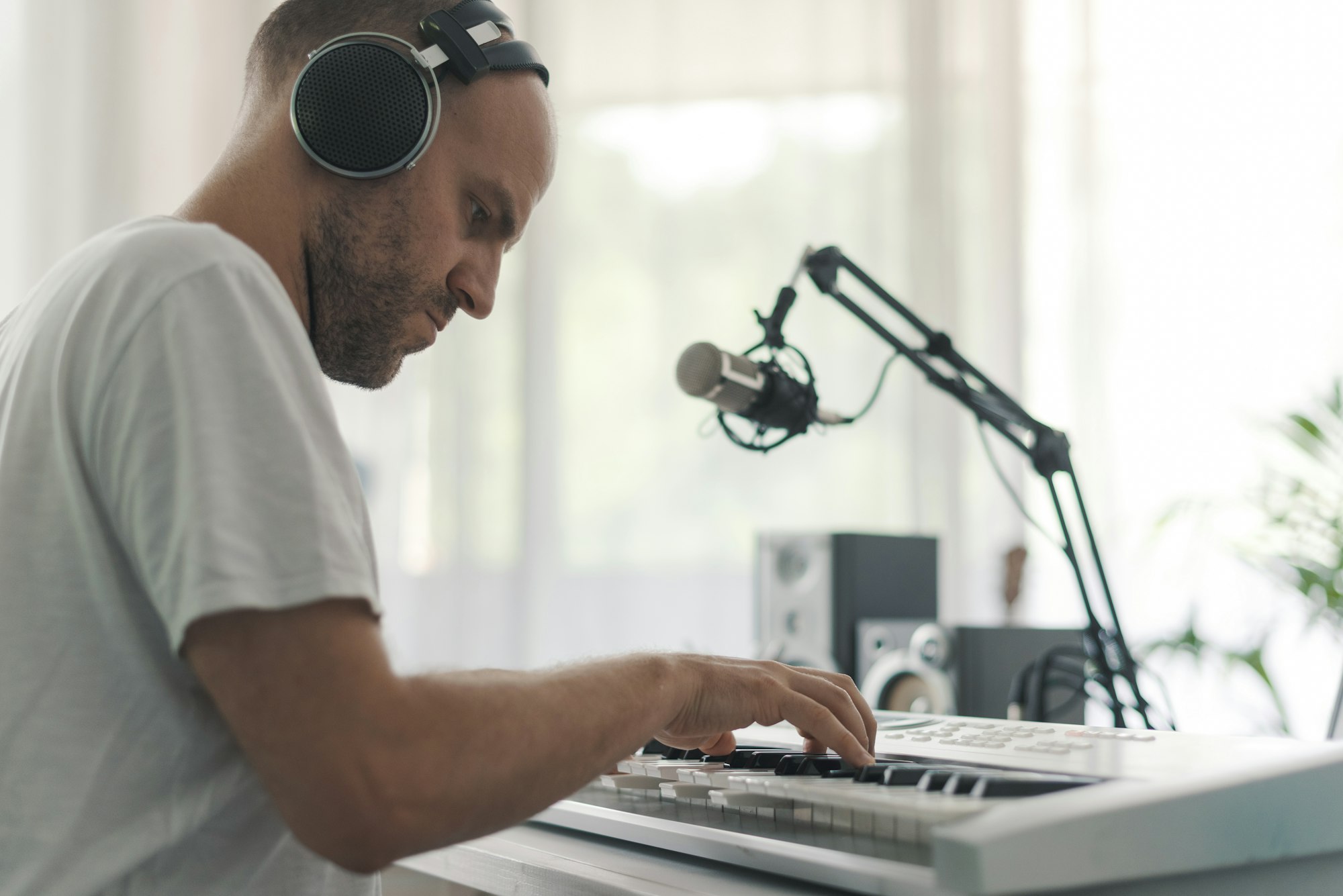 Professional musician playing and composing music at home