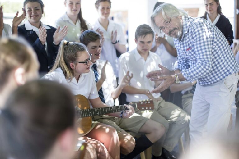 Teacher and students having music lessons outside